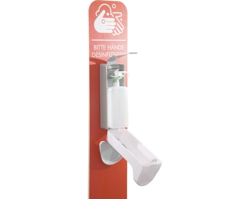 Wandmontierter Händedesinfektionsmittelspender mit Hinweisschild