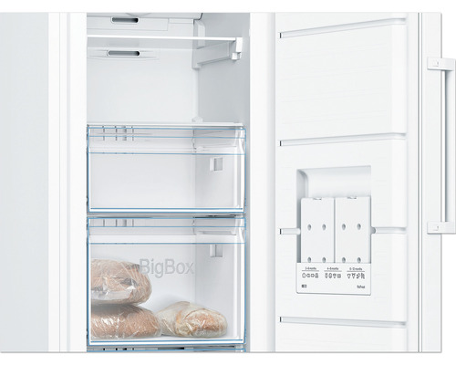 Intérieur d''un congélateur avec deux tiroirs et commandes