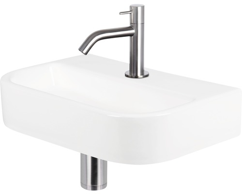 Lavabo en céramique blanche avec robinet
