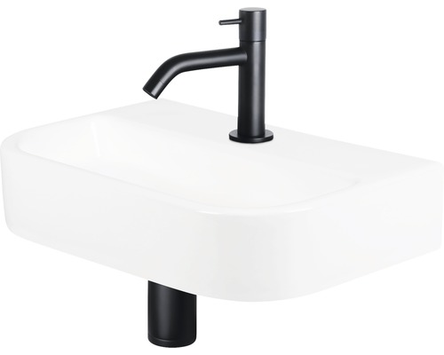 Waschtisch mit schwarzer Armatur und Ablaufgarnitur