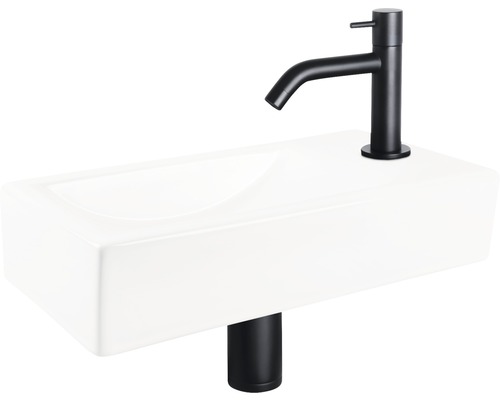 Aufsatzwaschbecken aus Keramik mit schwarzer Armatur