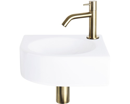 Weisses Aufsatzwaschbecken mit goldfarbener Armatur und Ablaufgarnitur