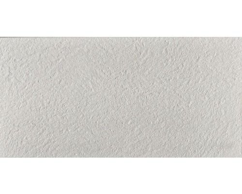 Carreau en céramique blanc avec une surface structurée.