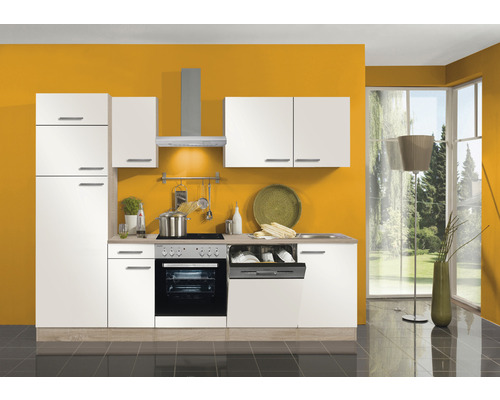 Cuisine moderne avec armoires blanches, hotte aspirante et appareils électriques devant un mur jaune