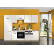 Cuisine complète avec appareils intégrés et façades blanches devant un mur jaune