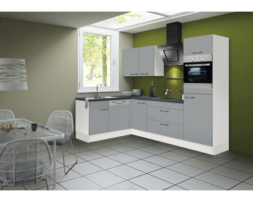 Cuisine moderne avec armoires grises, hotte aspirante et four.