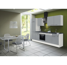 Cuisine moderne avec table à manger et chaises sous une suspension