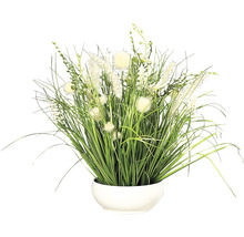 Dekorative Kunstpflanze mit Gräsern und Blüten in einem Topf