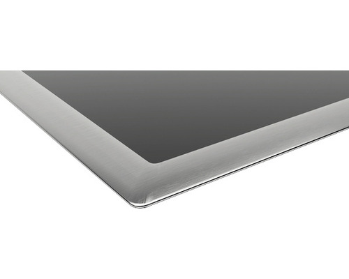 Vue détaillée d''une plaque de cuisson vitrocéramique avec cadre en acier inoxydable