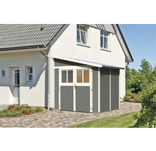 Abri de jardin en bois gris avec double porte à une maison