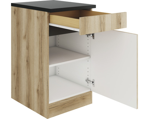 Meuble bas avec tiroir, porte ouverte et étagères