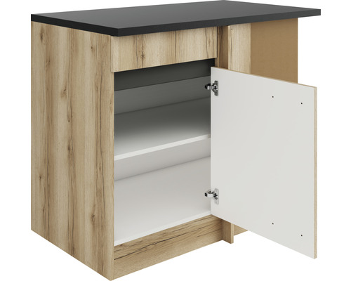 Meuble bas de cuisine avec porte ouverte, étagères et plan de travail