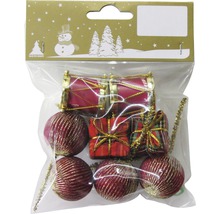 Verpackung mit Christbaumschmuck in Form von Kugeln, Geschenken und Trommeln