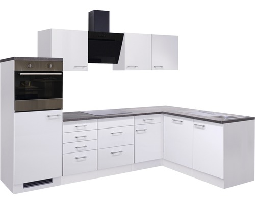 Cuisine complète avec armoires blanches, hotte aspirante et four