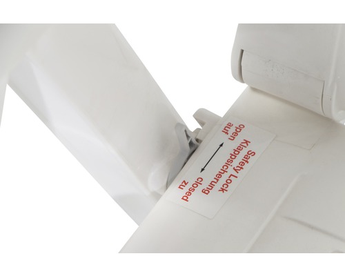 Detailansicht einer Klappsicherung mit der Beschriftung ''Safety Lock Klappsicherung offen/zu''.