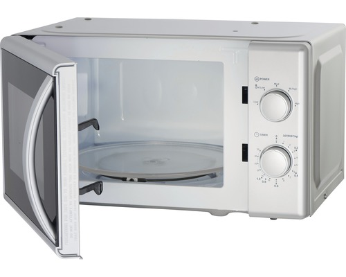 Micro-ondes ouvert avec plateau tournant et éléments de commande