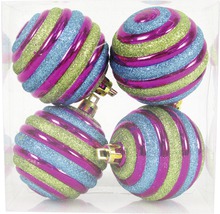 Quatre boules de Noël à motif spiralé dans un emballage
