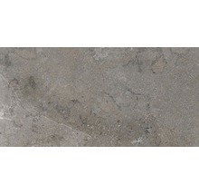 Gros plan d'un carreau de sol gris avec motif de pierre