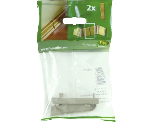 Deux coins de plinthes dans un emballage en plastique.