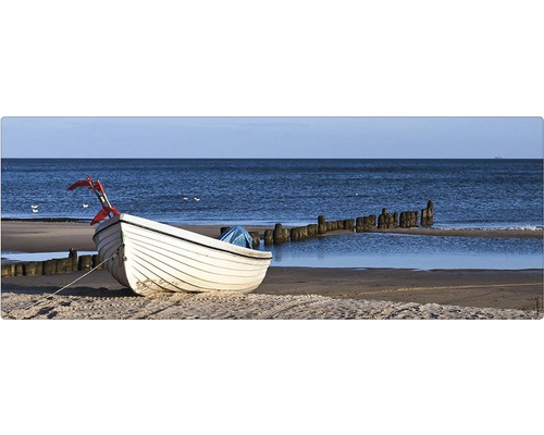 Paroi arrière de salle de bains mySPOTTI aqua Boat 120x45 cm Un bateau blanc est allongé sur la plage