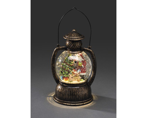 Boule à neige avec Père Noël et sapin de Noël dans une lanterne