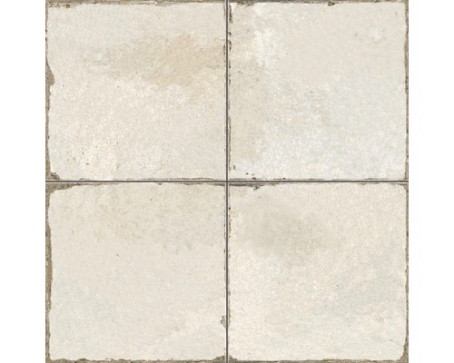 Quatre carreaux beiges forment un carré.