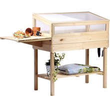 Table de culture en bois avec espace de rangement et accessoires de plantation.