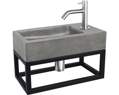 Lavabo en béton avec cadre en acier et robinet
