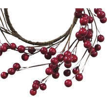 Couronne décorative avec des baies rouges et des branches