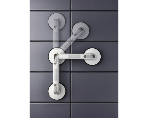 Poignée de maintien avec ventouses sur un mur carrelé