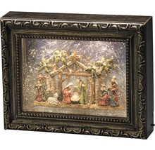 Weihnachtskrippe in einem Bilderrahmen mit Beleuchtung und Schneegestöber-Effekt.