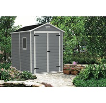 Abri de jardin gris avec fenêtre dans le jardin
