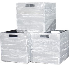 Drei Holzkisten gestapelt mit Griffen