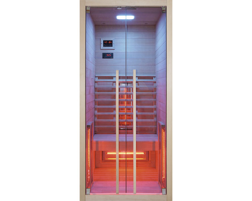 Sauna infrarouge avec porte en verre et revêtement en bois.