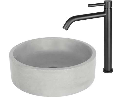 Rundes Aufsatzwaschbecken aus Beton mit schwarzem Wasserhahn