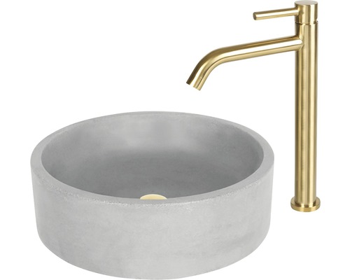 Vasque à poser ronde en béton avec robinetterie dorée