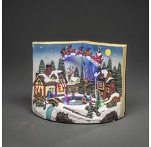 Weihnachtsdekoration mit Weihnachtsmann im Schlitten über einem Dorf