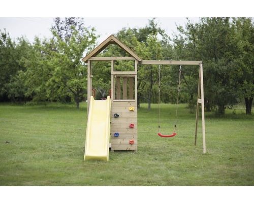 Tour de jeu avec toboggan, balançoire et mur d''escalade dans le jardin