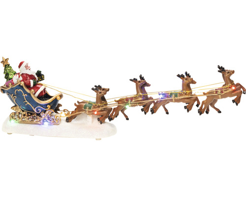 Scène de Noël décorative avec le Père Noël dans un traîneau tiré par des rennes