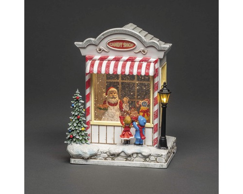Weihnachtsdekoration: Süsswarenladen mit Weihnachtsmann und Kindern