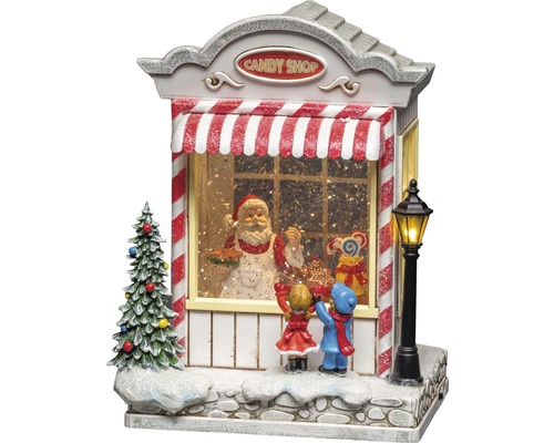 Dekorative Schneekugel mit Candy Shop, Weihnachtsmann und Kindern als Weihnachtsdekoration