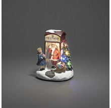 Dekorative Weihnachtsszene mit Telefonzelle, Weihnachtsmann und Mädchenfigur