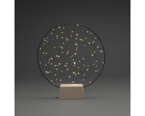 Dekorative Tischleuchte mit LED-Lichtern in einem runden Drahtrahmen auf einem Sockel