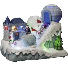 Dekorative Winterlandschaft mit Burg, Iglu, Pinguinen, Schneemännern und Skifahrern