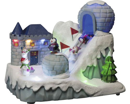 Dekorative Winterlandschaft mit Burg, Iglu, Pinguinen, Schneemännern und Skifahrern