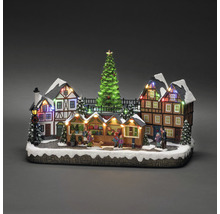 Beleuchtete Miniatur Weihnachtsmarktszene mit Häusern und Weihnachtsbaum