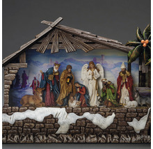 Crèche de Noël avec figurines sous un toit en bois