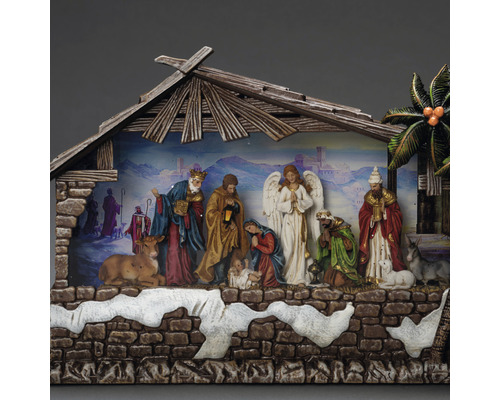 Crèche de Noël avec figurines sous un toit en bois