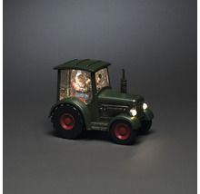 Boule à neige décorative avec le père Noël dans un tracteur