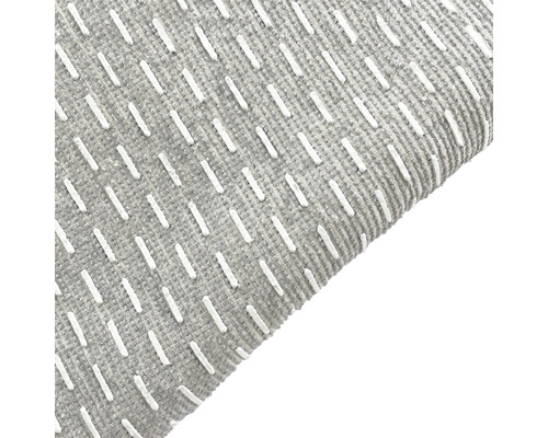 Gros plan d''un tapis gris à motifs